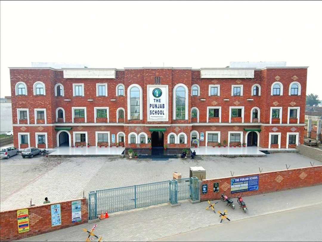 The Punjab School building near Al Rehman Garden Phase 8 at sunset